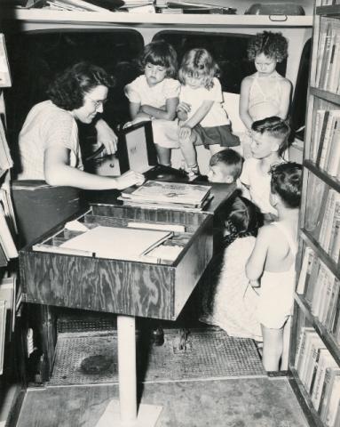 Children's Librarian Hazel Whipple and children at a stop in Algansee, Oct. 14, 1948