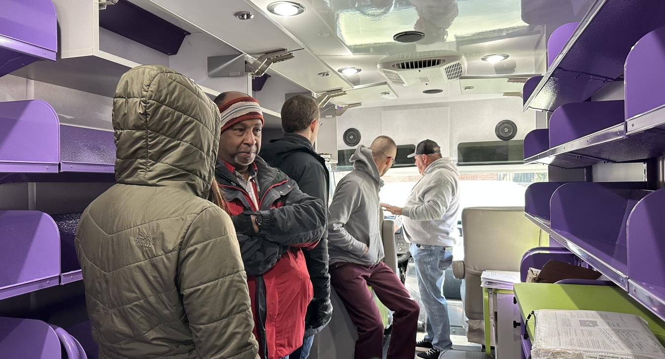 The BDL-Coldwater team touring the bookmobile.